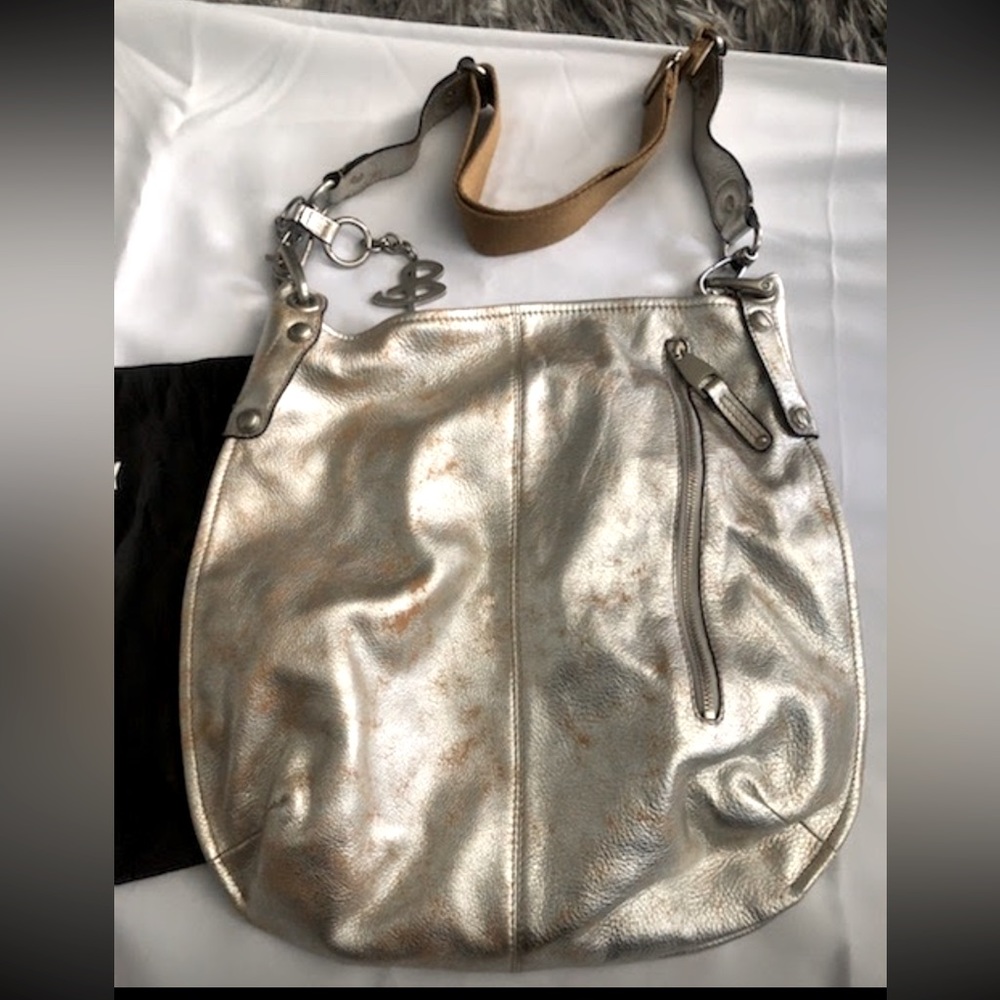 B. Makowsky leather bag. Distressed silver with tan and silver canvas strap.